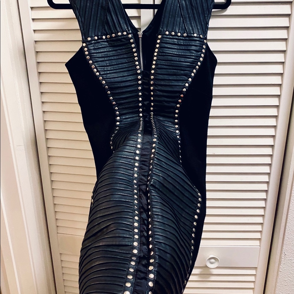 Black stretchy faux leather trimmed dress.